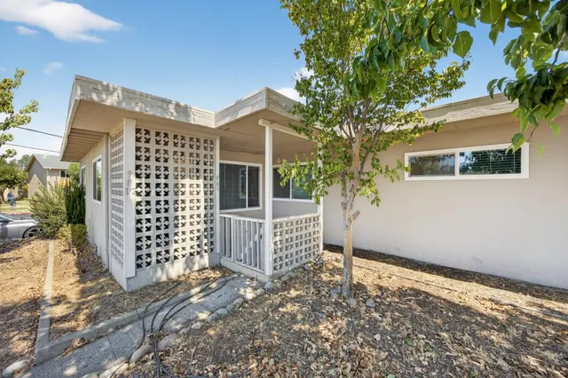 a view of a house with a tree