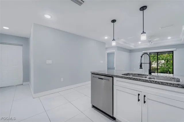 a kitchen with a sink and a window