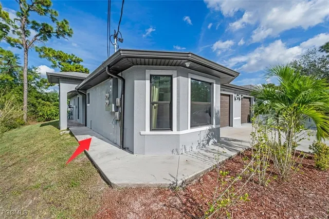 a view of wooden house with a yard
