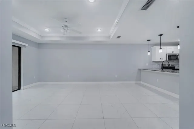 a view of an empty room and window