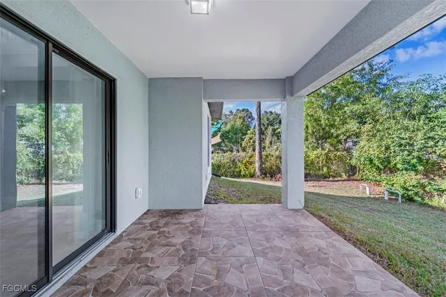 an aerial view of a house with a yard and garden