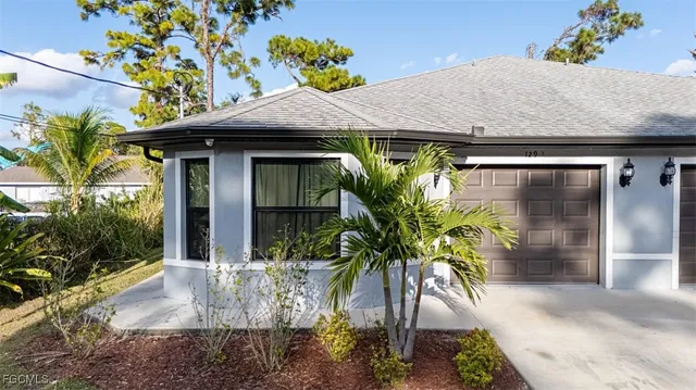 a potted plant sitting in front of a house