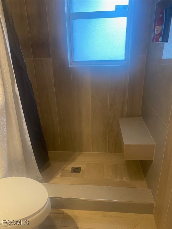 114 Oleander Road Lehigh Acres, FL 33936 - Photo 11 of 17 a bathroom with a toilet and a bathtub