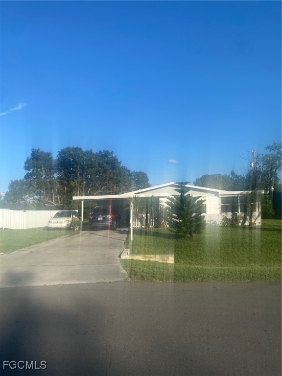 114 Oleander Road Lehigh Acres, FL 33936 - Photo 2 of 17 a view of swimming pool from a yard