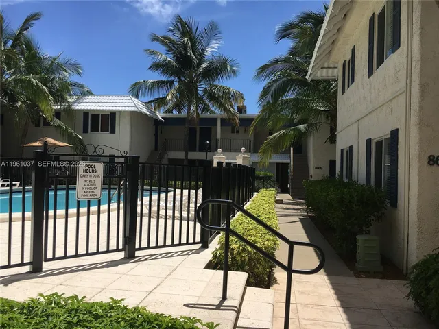 a front view of a house with parking space