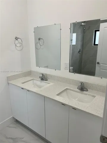 a stove top oven sitting inside of a kitchen