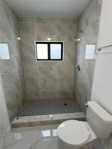 a refrigerator freezer sitting in a room