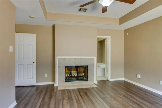 wooden floor fireplace and natural light