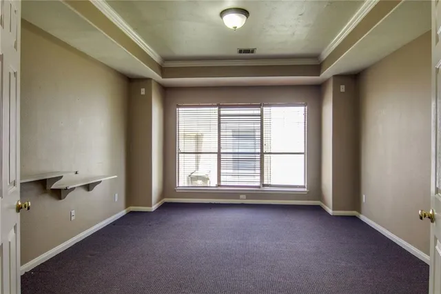 an empty room with a empty space and a window