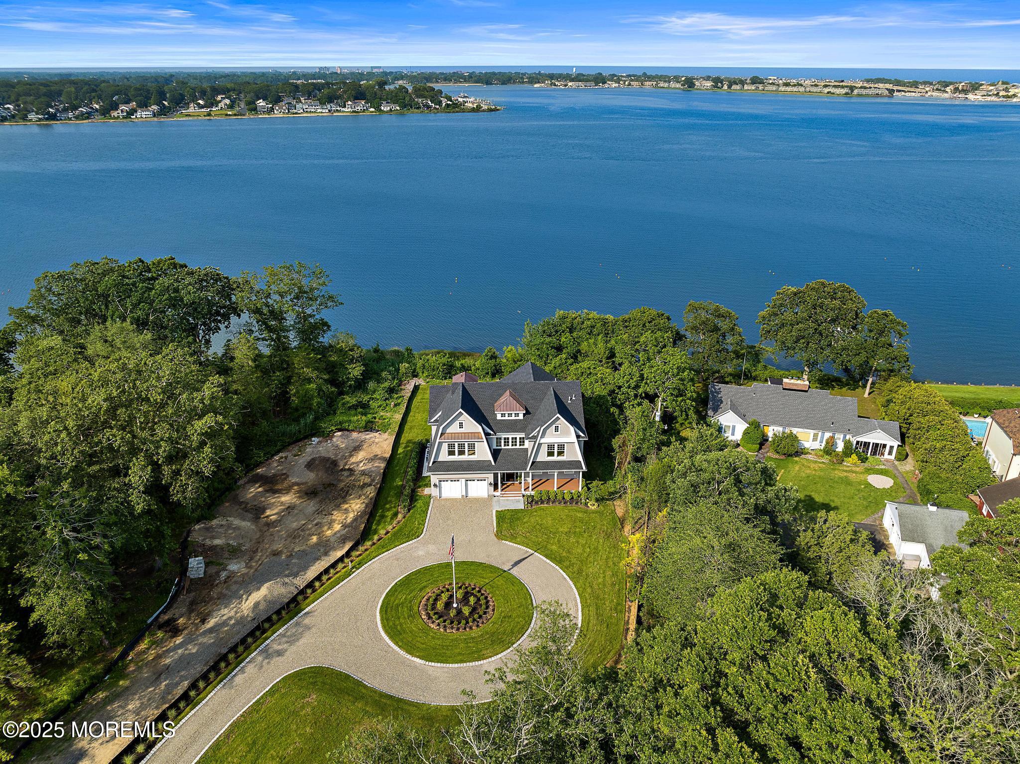 1604 Marconi Road Wall, NJ 07719 - Photo 1 of 69 an aerial view of a house with a lake view