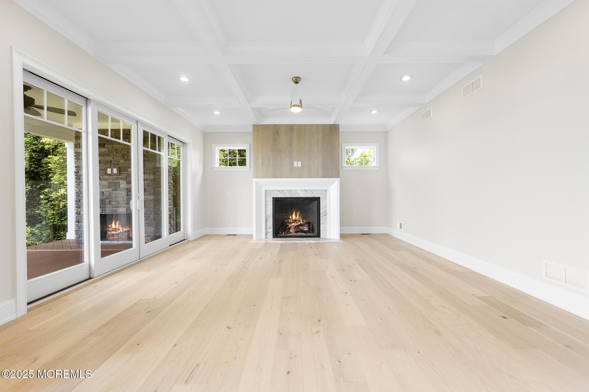 1604 Marconi Road Wall, NJ 07719 - Photo 21 of 69 a view of an empty room with a fireplace and a window