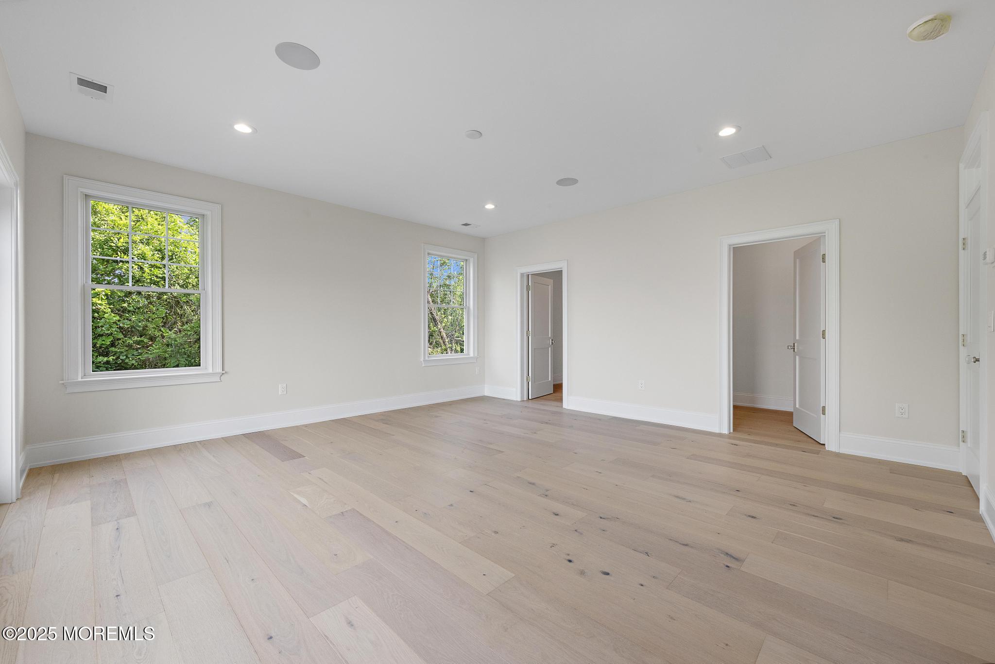 1604 Marconi Road Wall, NJ 07719 - Photo 43 of 69 an empty room with wooden floor and windows