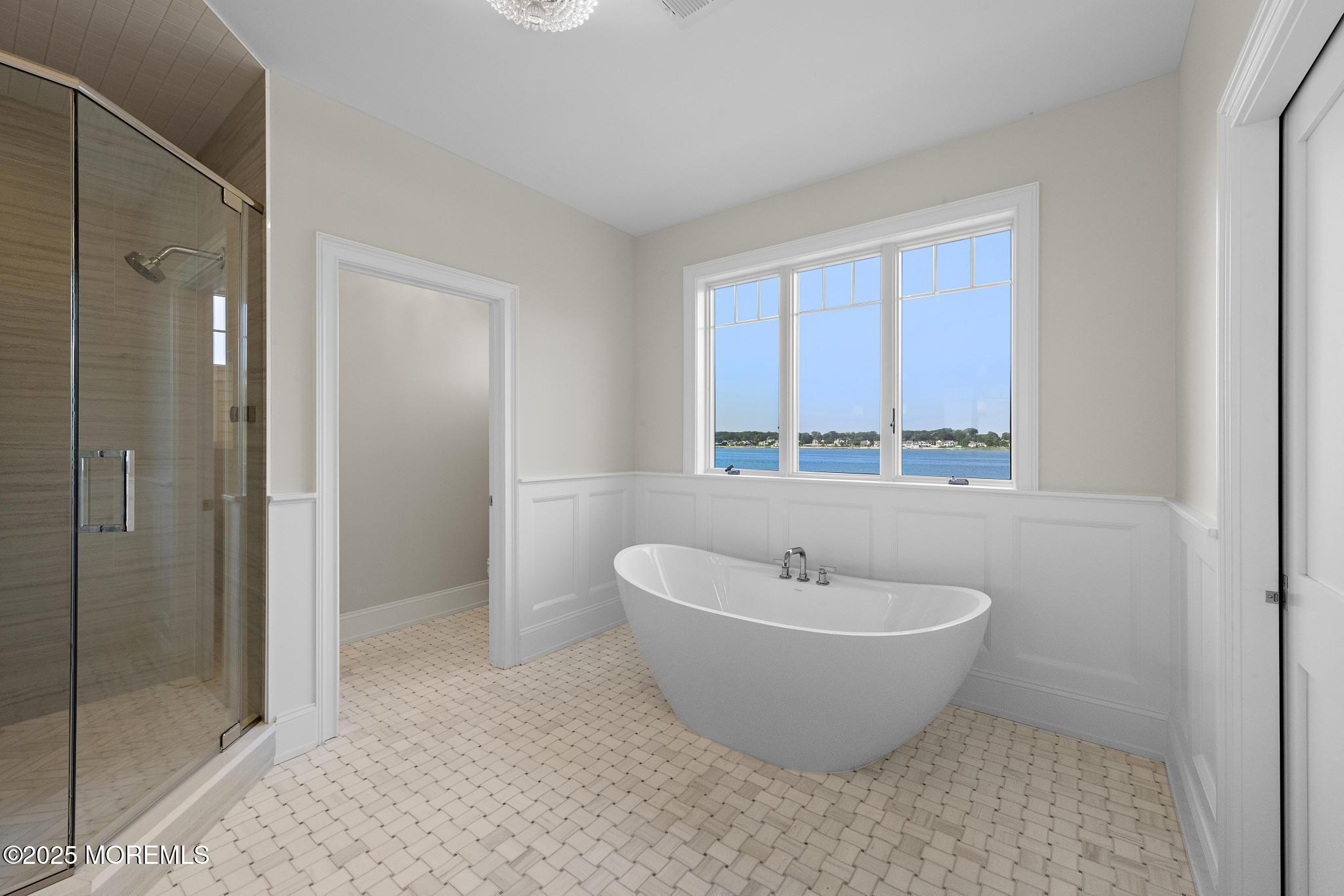 1604 Marconi Road Wall, NJ 07719 - Photo 46 of 69 a spacious bathroom with a bathtub and shower