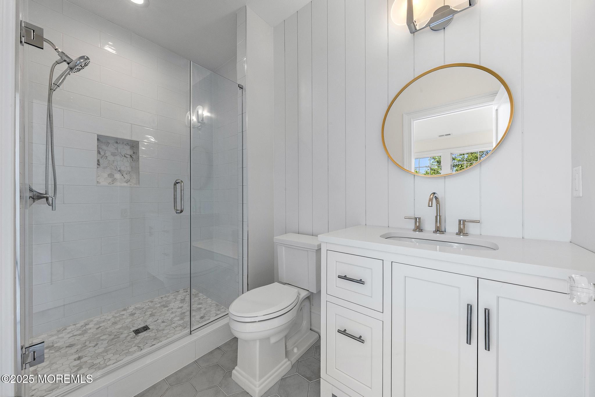 1604 Marconi Road Wall, NJ 07719 - Photo 50 of 69 a bathroom with a toilet a sink and a mirror
