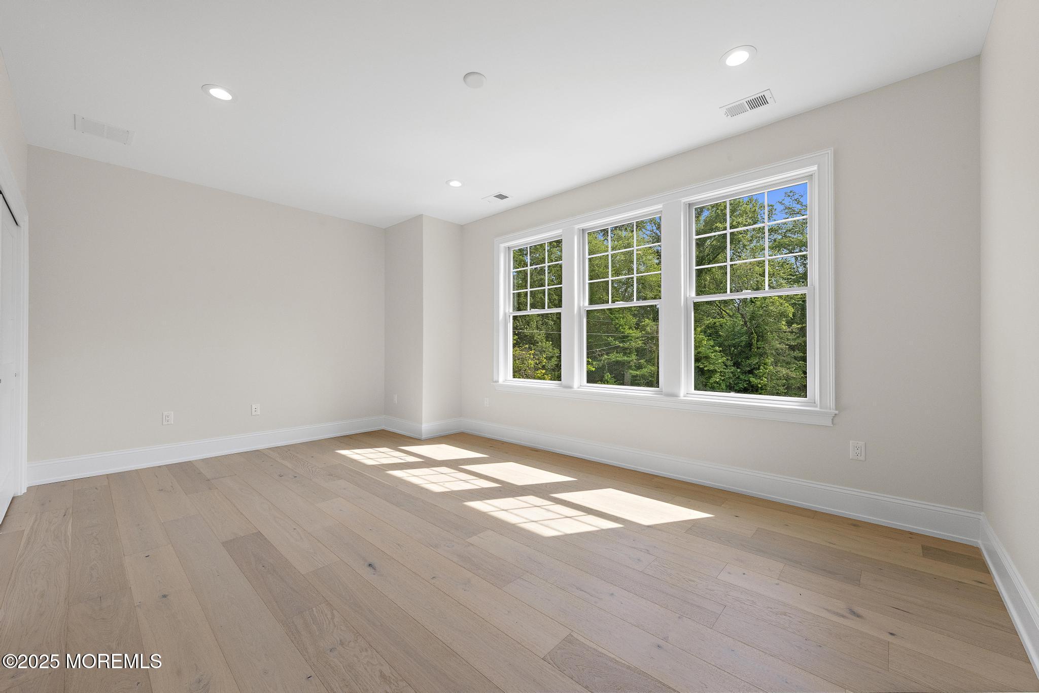 1604 Marconi Road Wall, NJ 07719 - Photo 51 of 69 an empty room with wooden floor and windows