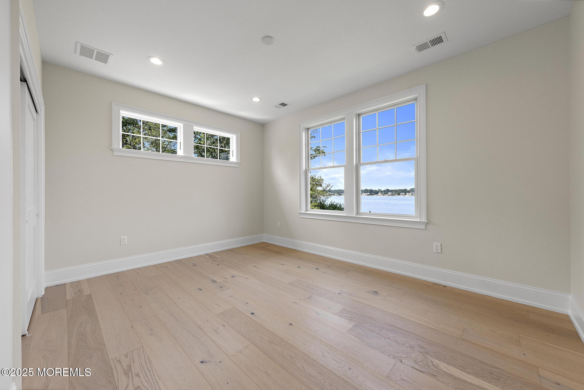 1604 Marconi Road Wall, NJ 07719 - Photo 52 of 69 a view of a big room with wooden floor and windows