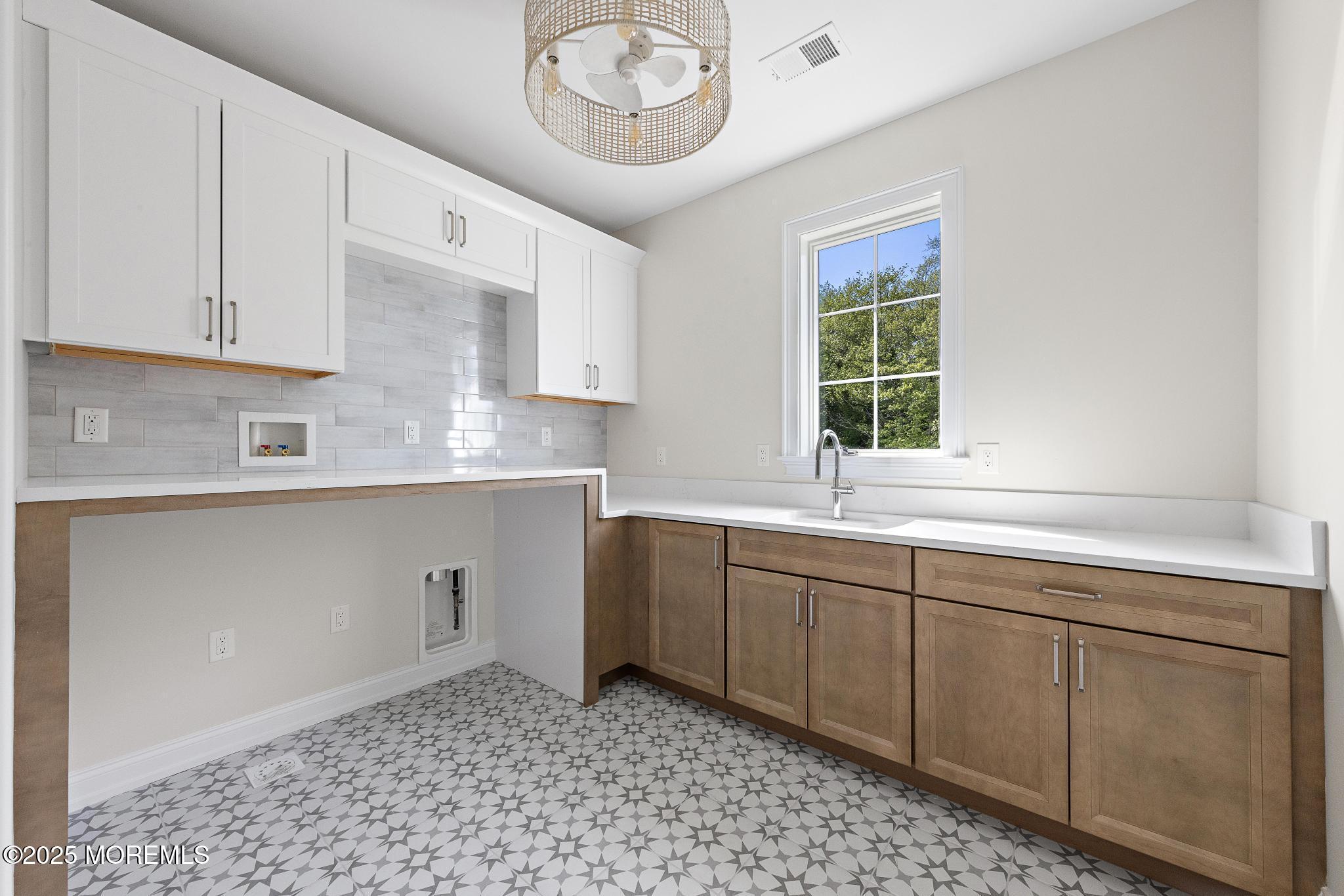 1604 Marconi Road Wall, NJ 07719 - Photo 55 of 69 a kitchen with a sink and cabinets
