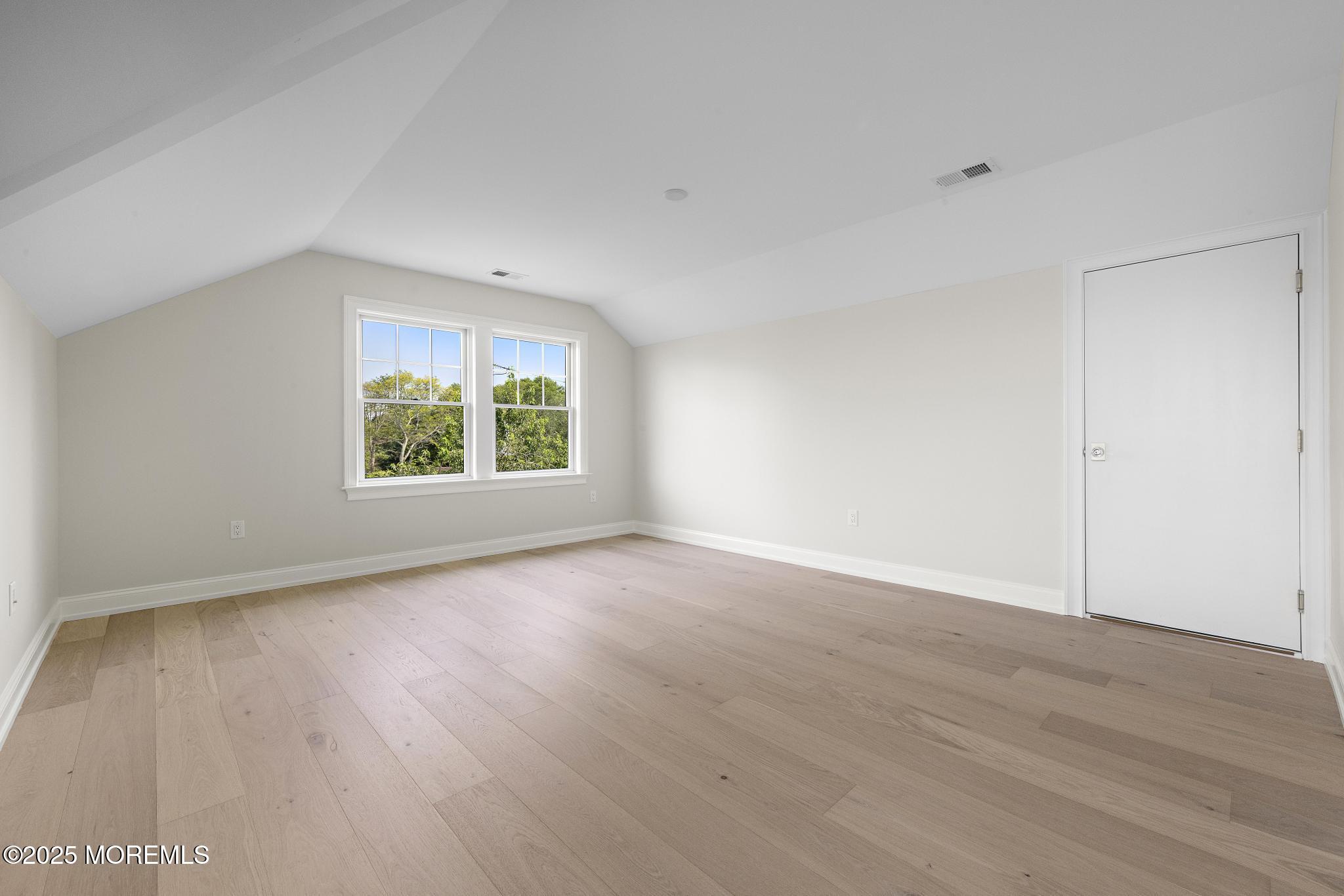 1604 Marconi Road Wall, NJ 07719 - Photo 59 of 69 an empty room with wooden floor and windows