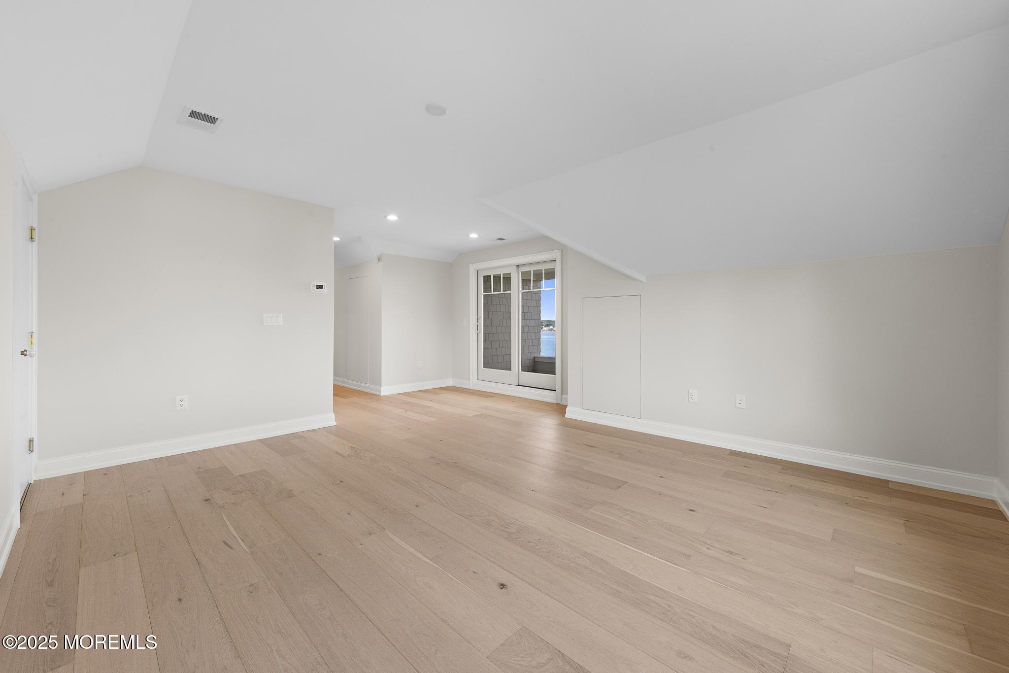 1604 Marconi Road Wall, NJ 07719 - Photo 60 of 69 a view of an empty room with wooden floor and a window