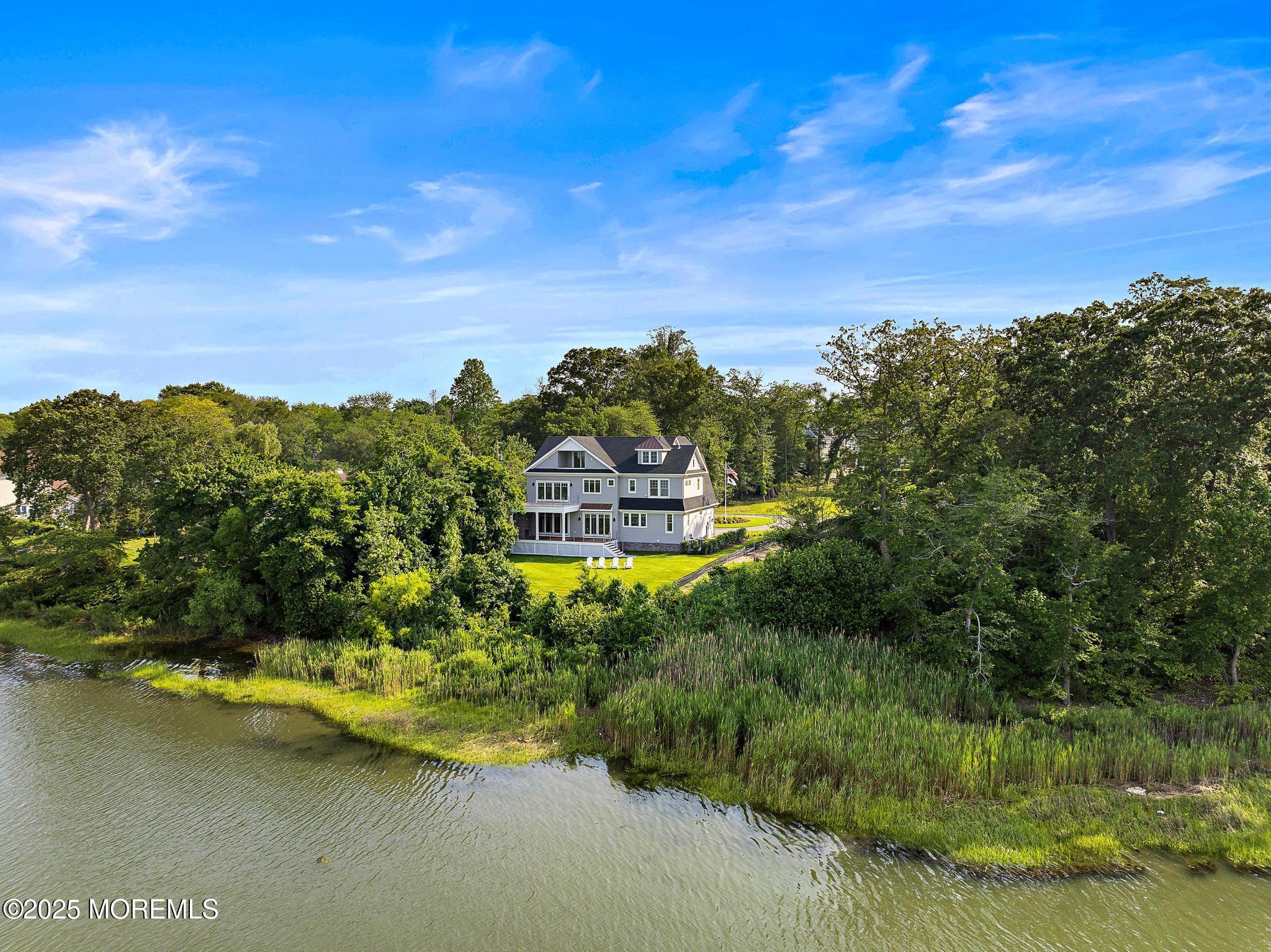 1604 Marconi Road Wall, NJ 07719 - Photo 9 of 69 a view of a lake with a yard