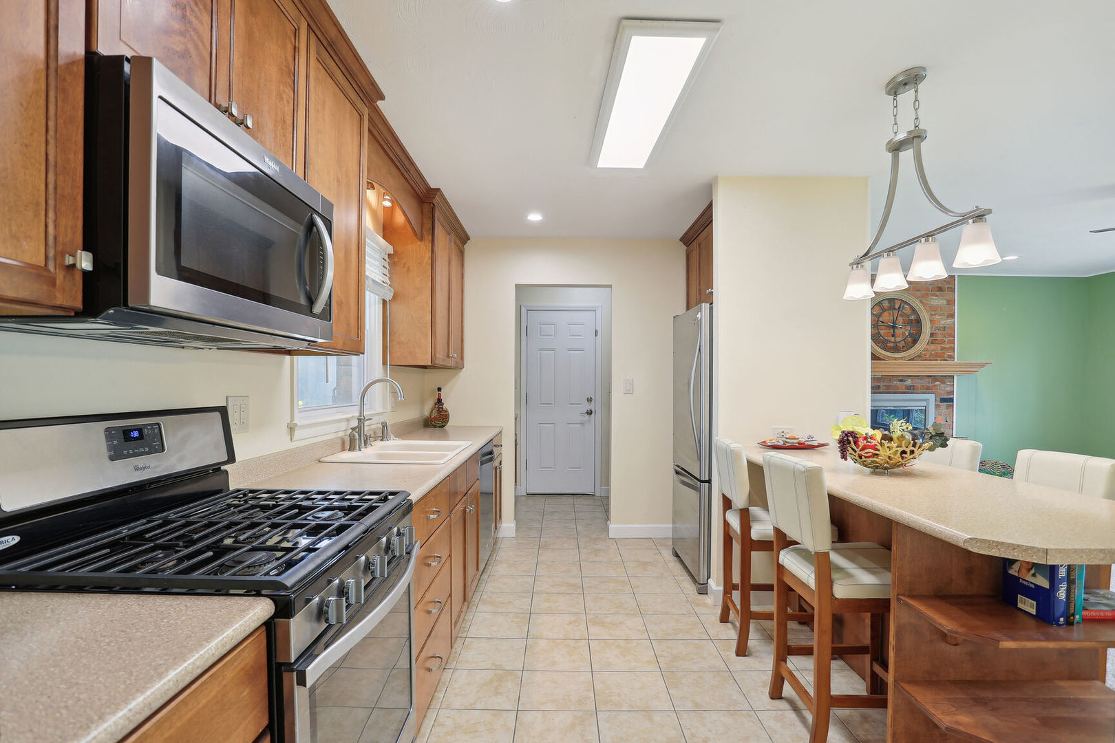 1111 Theodore Drive Champaign, IL 61821 - Photo 11 of 34 a kitchen with a stove a sink and a microwave