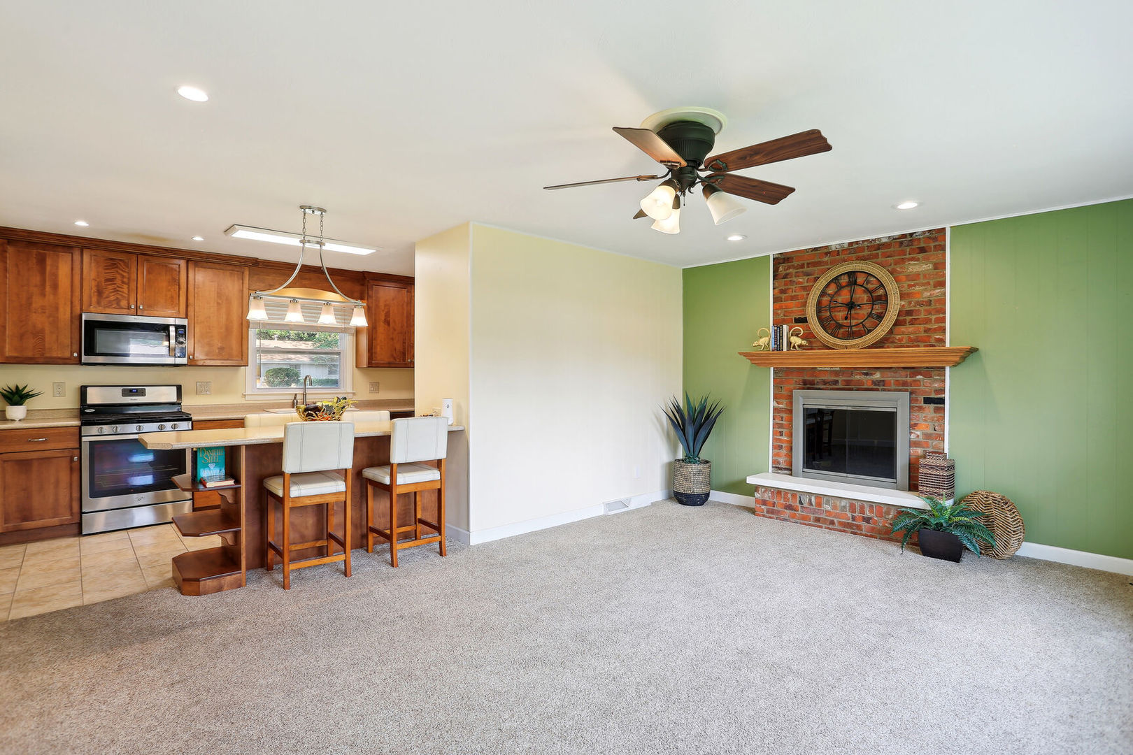 1111 Theodore Drive Champaign, IL 61821 - Photo 12 of 34 a view of a livingroom with furniture and a fireplace