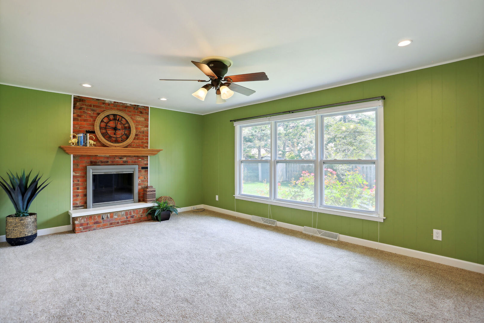 1111 Theodore Drive Champaign, IL 61821 - Photo 16 of 34 a view of an empty room with a fireplace and a window