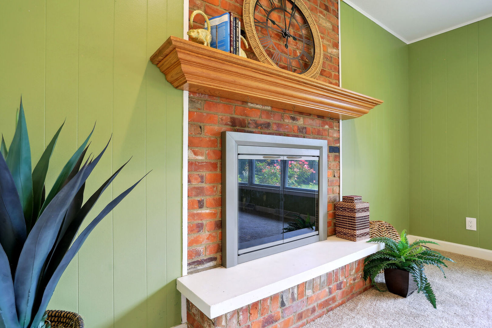 1111 Theodore Drive Champaign, IL 61821 - Photo 17 of 34 a living room with a table and a potted plant