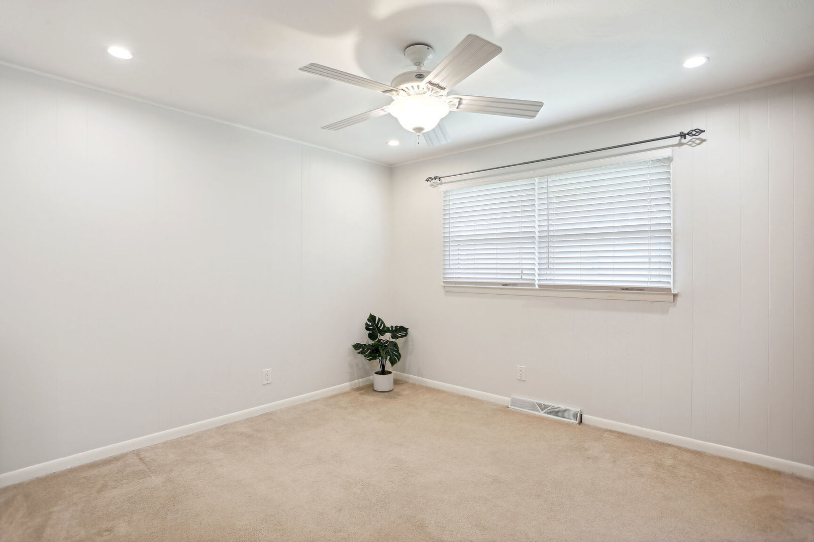 1111 Theodore Drive Champaign, IL 61821 - Photo 21 of 34 an empty room with a window and a fan