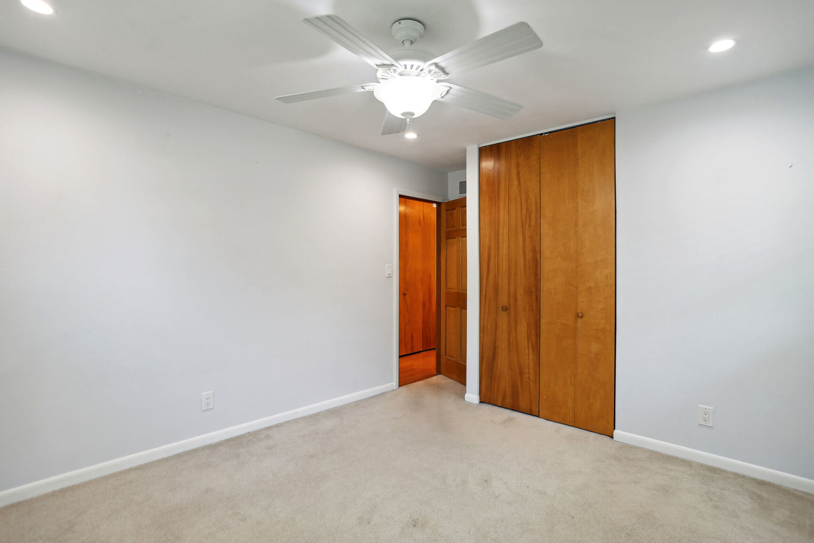 1111 Theodore Drive Champaign, IL 61821 - Photo 24 of 34 an empty room with a chandelier fan and closet