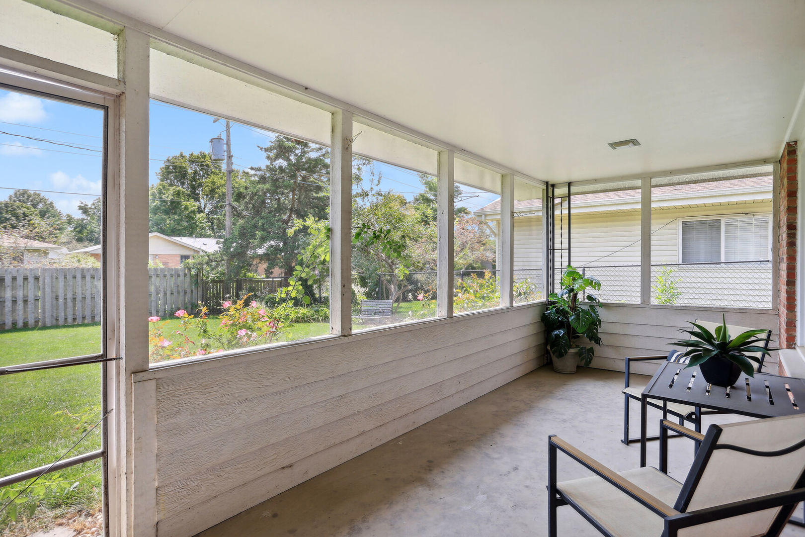 1111 Theodore Drive Champaign, IL 61821 - Photo 29 of 34 a room with furniture and a potted plant