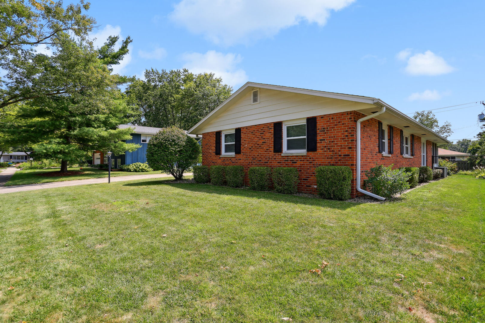 1111 Theodore Drive Champaign, IL 61821 - Photo 3 of 34 a front view of house with yard and trees in the background