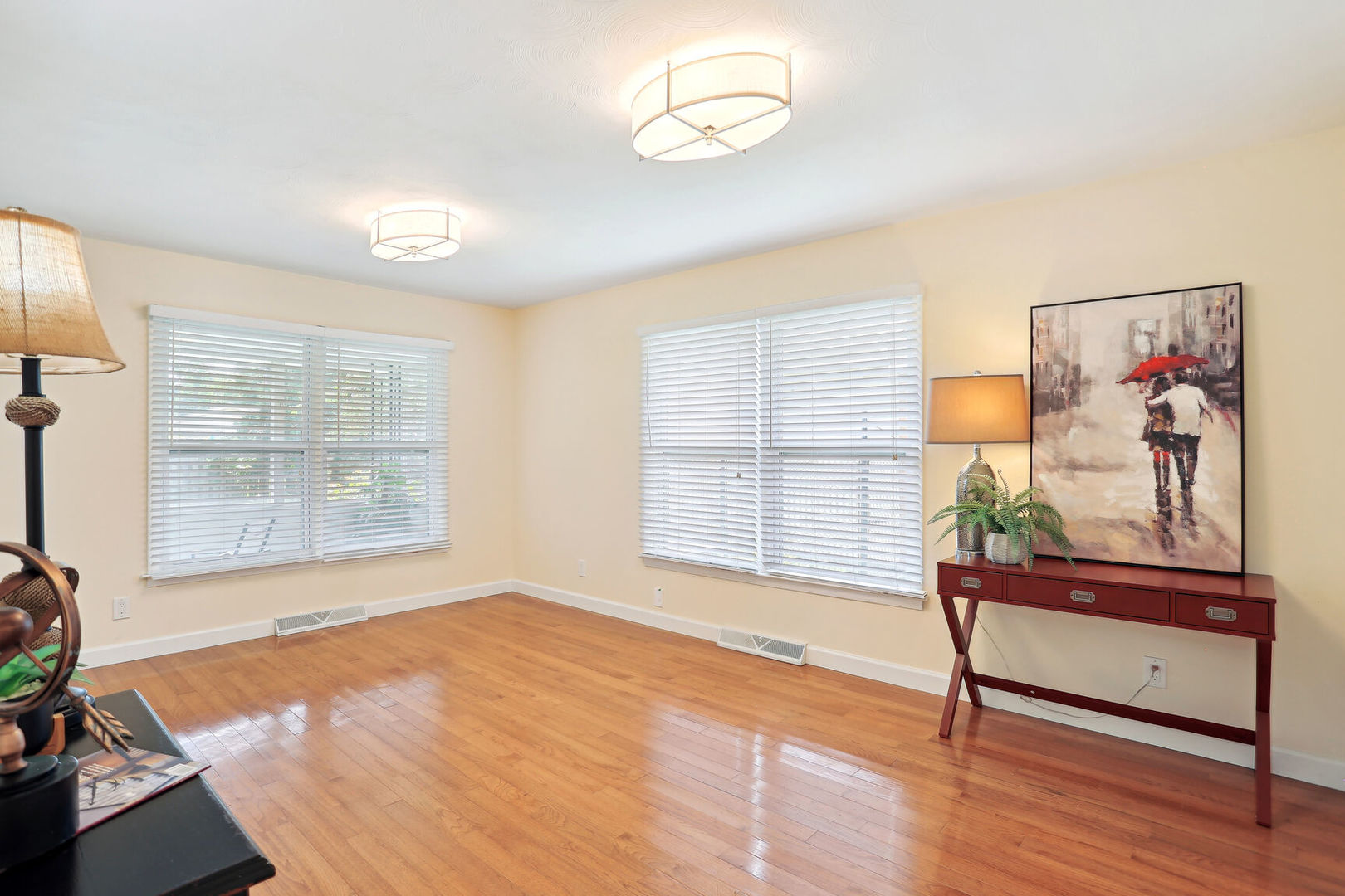 1111 Theodore Drive Champaign, IL 61821 - Photo 6 of 34 a view of an empty room with a window and wooden floor