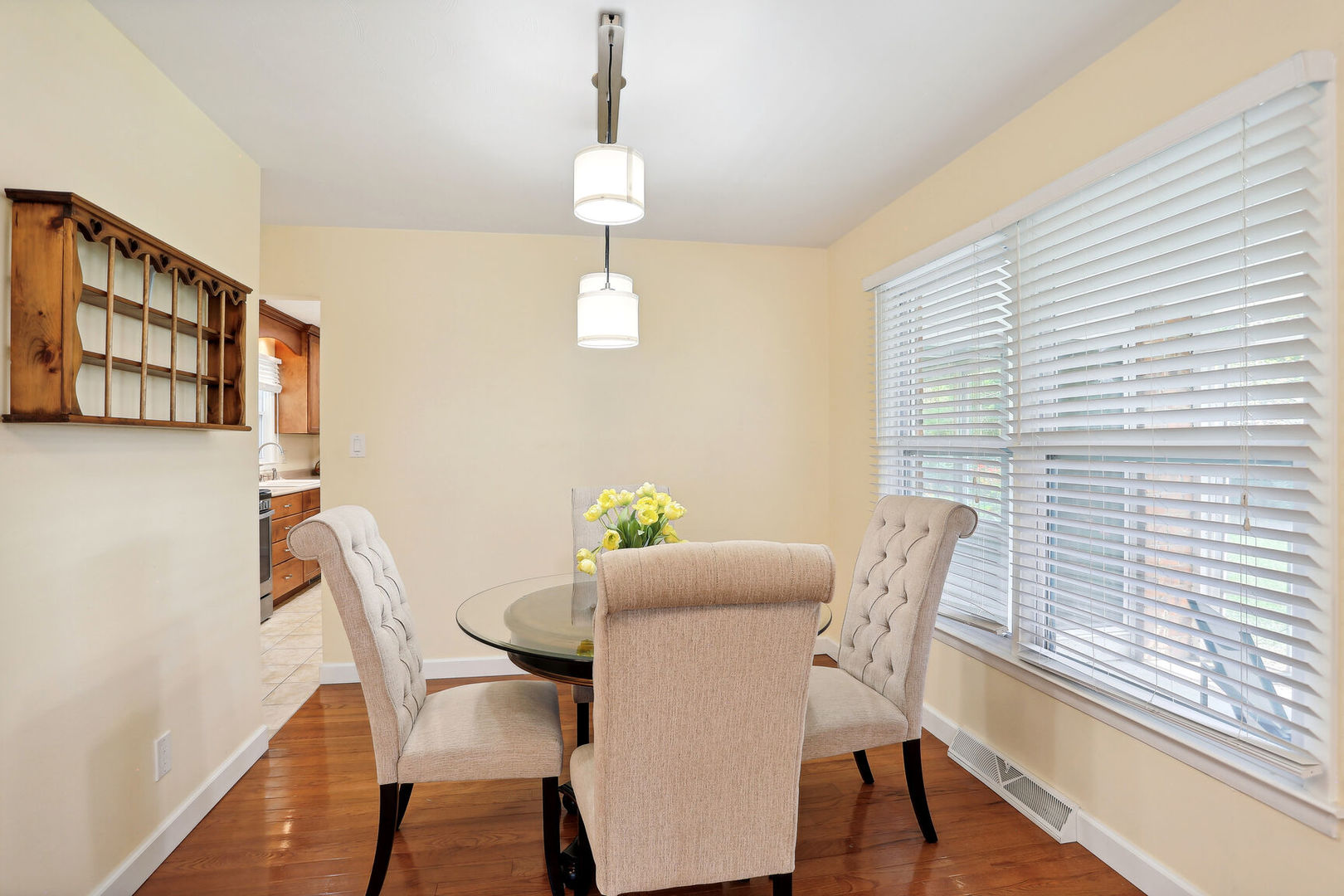 1111 Theodore Drive Champaign, IL 61821 - Photo 8 of 34 a view of a dining room with furniture a chandelier and wooden floor