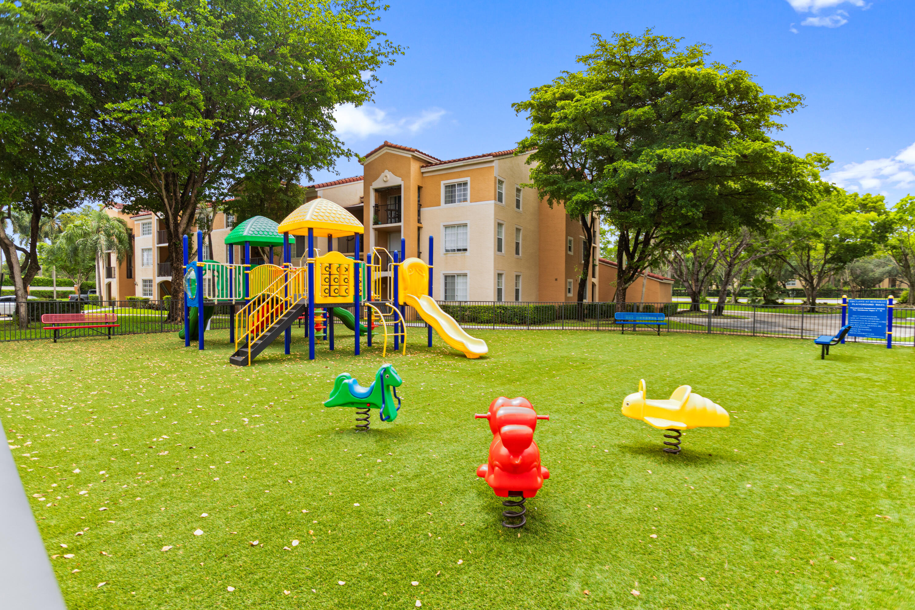 2113 Renaissance Boulevard, Unit 306 Miramar, FL 33025 - Photo 58 of 59 a childrens park with lots of swings and slides