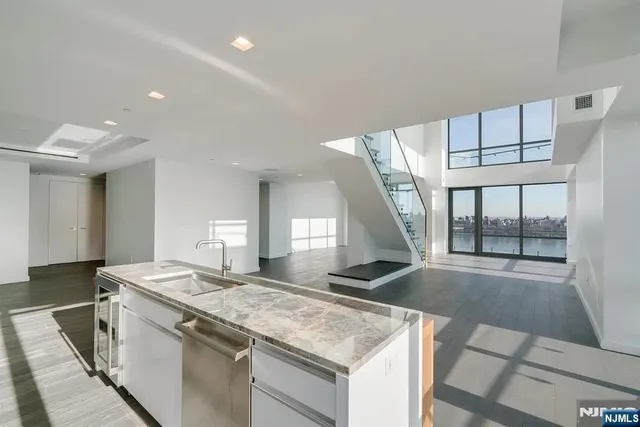 a kitchen with a stove and a sink