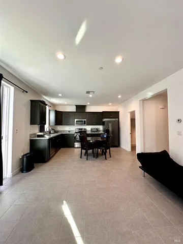 a view of table room with wooden floor and windows