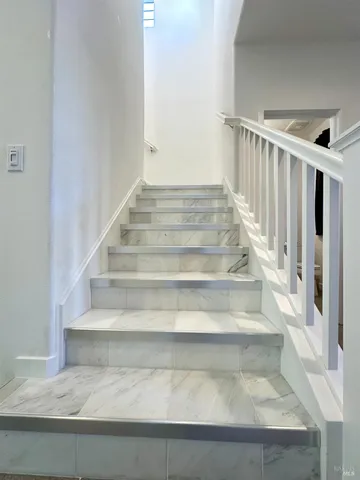 a living room with furniture rug and window