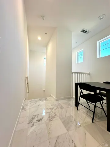 a bedroom with a bed and a chair