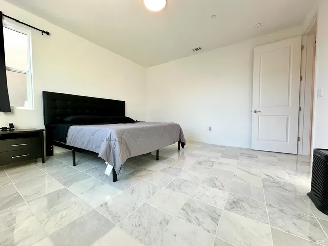 a view of a bathroom with a tub and shower
