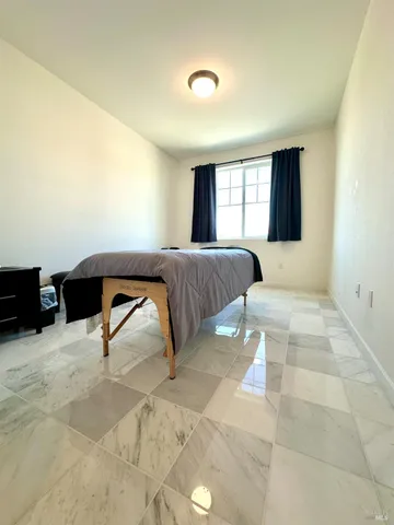 a bathroom with a toilet a sink and a window