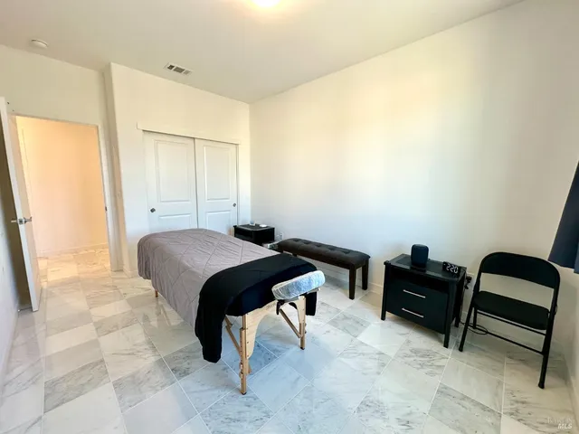 a bathroom with a toilet a sink and a mirror