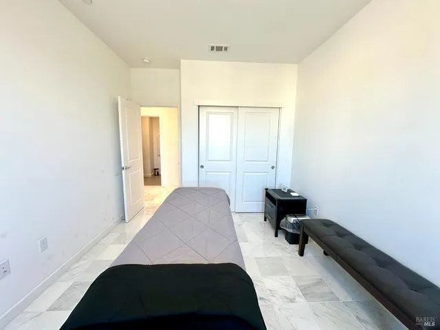 a bathroom with a toilet a sink and a mirror