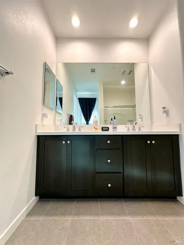 a patio with table and chairs