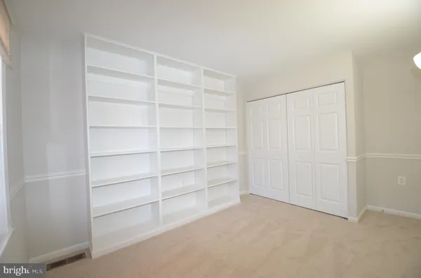 a view of an empty room with empty racks