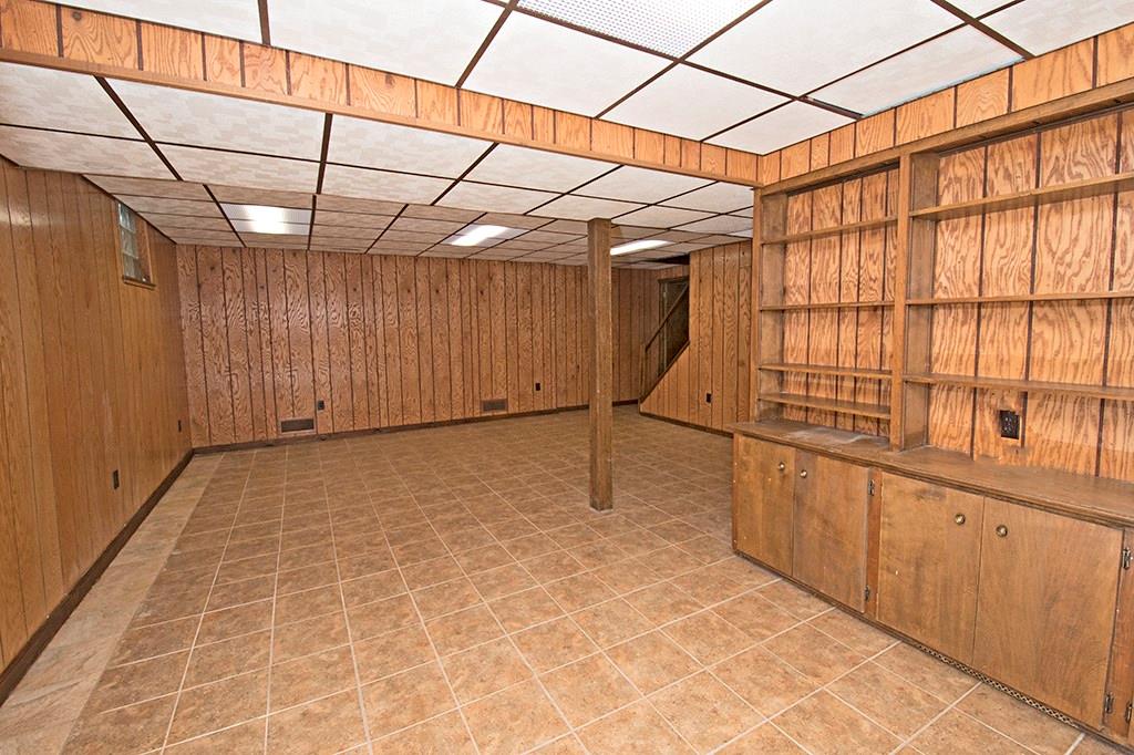 440 Markle Road Apollo, PA 15613 - Photo 24 of 25 Great basement game room! Ceramic tile flooring, cozy rustic flavor. Newly installed French Drain system