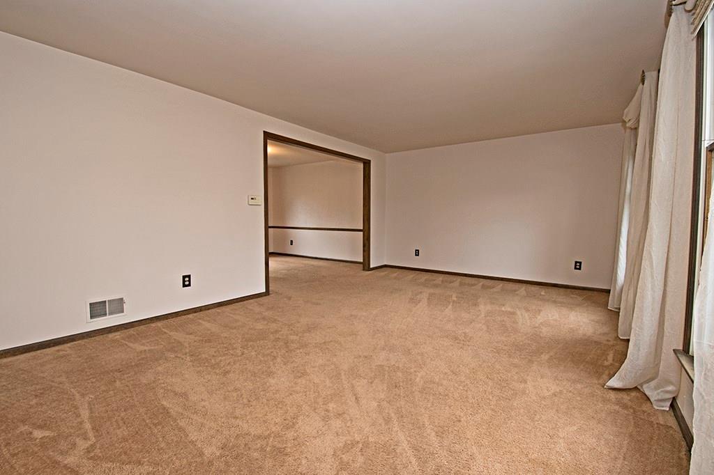 440 Markle Road Apollo, PA 15613 - Photo 8 of 25 The formal living room flows to the formal dining room beyond.