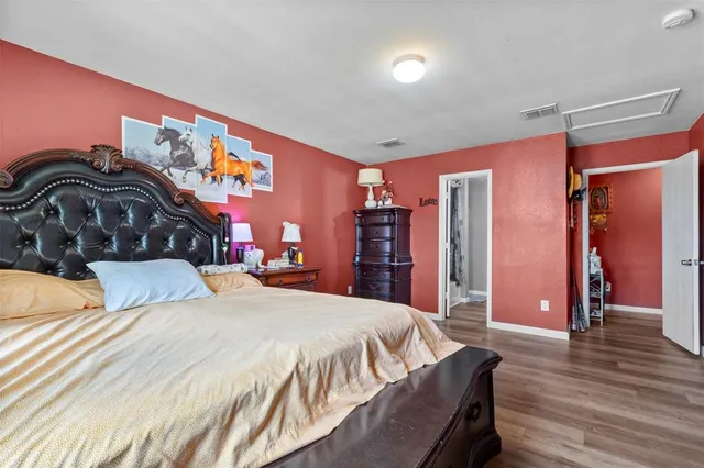 a bedroom with a bed and a closet