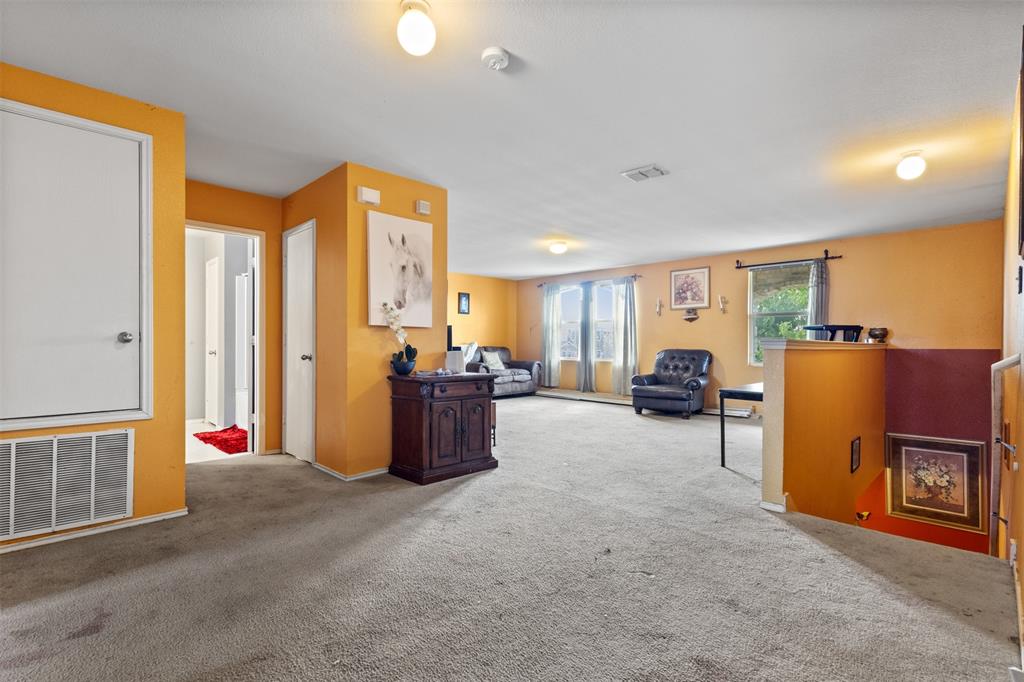 1034 Hollow Oak Road Lancaster, TX 75134 - Photo 18 of 29 a bed room with furniture and a window