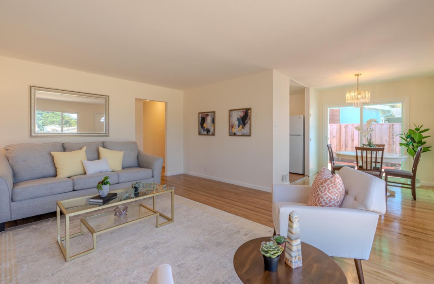 227 Marina Way Pacifica, CA 94044 - Photo 5 of 31 a living room with furniture and a wooden floor